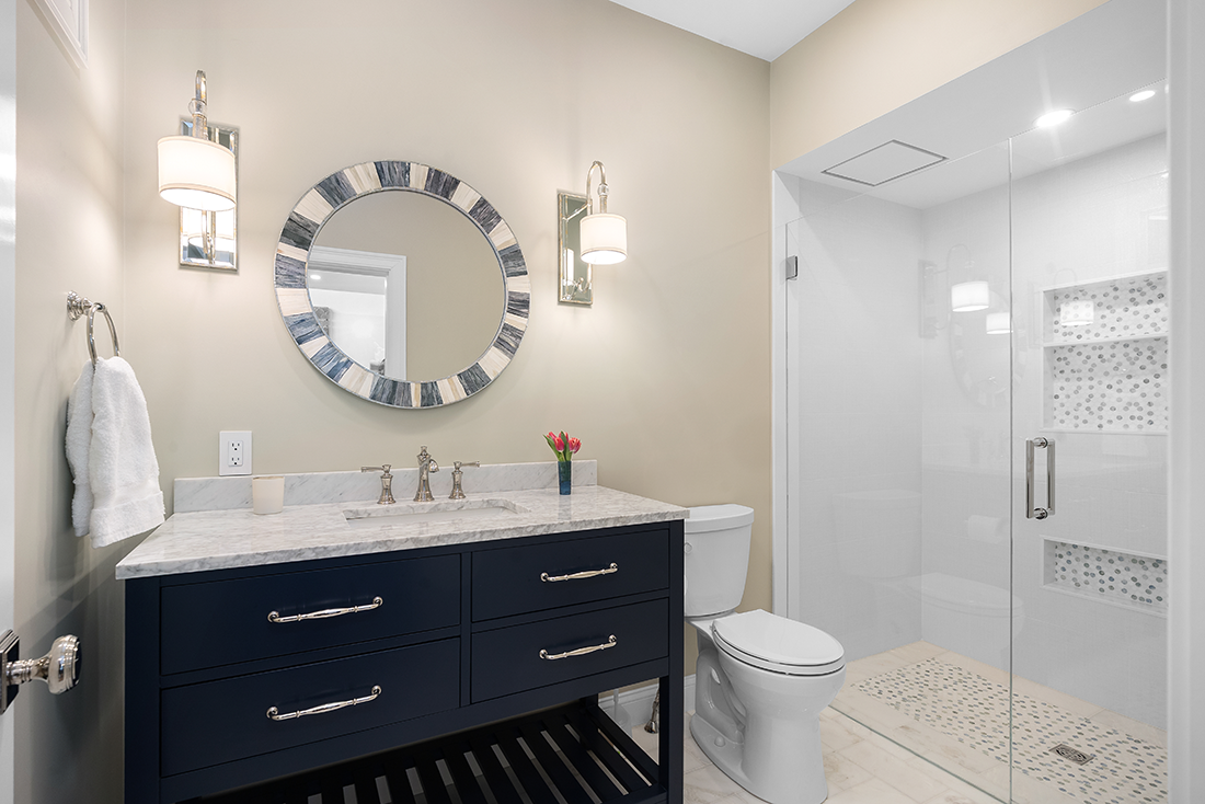Bathroom Remodel with White Tiling and a Black Sink
