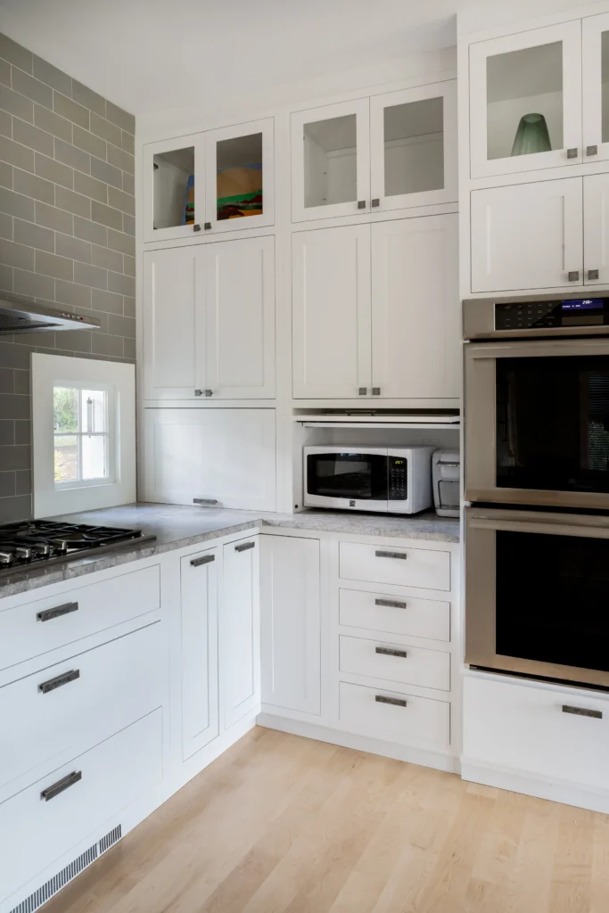Kitchen remodel by Marlene & Co with custom tiling