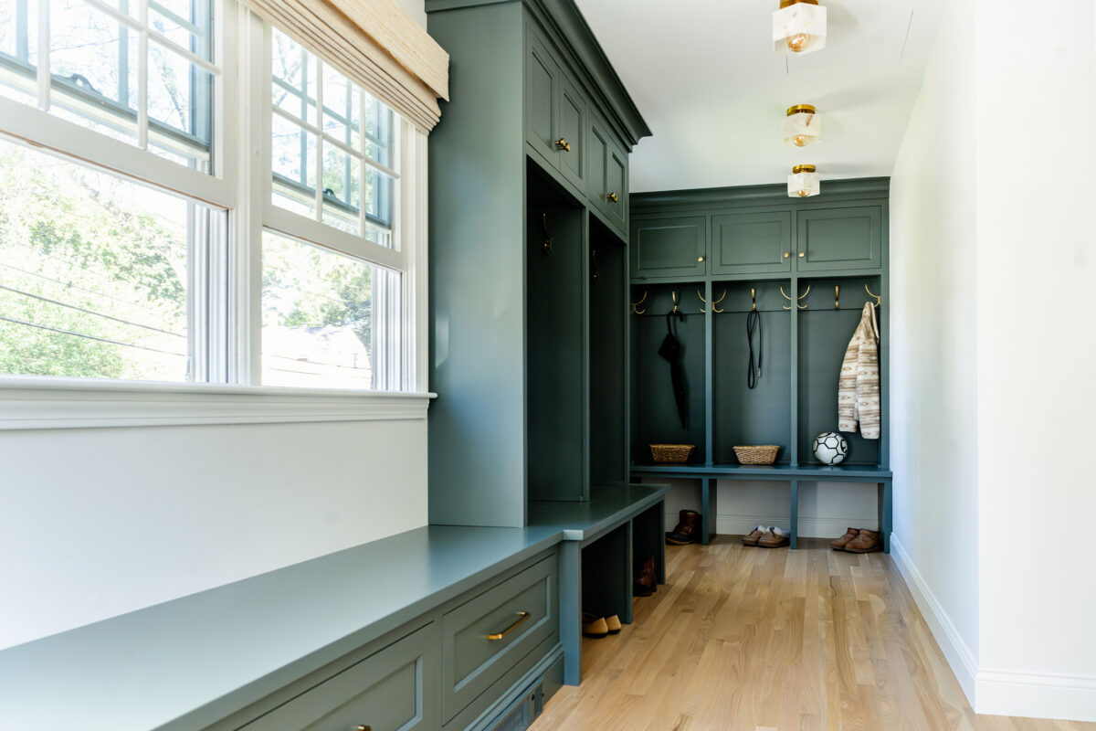 Mudroom with custom cabinetry so everything has a place after the space had been renovated by Marlene & Co