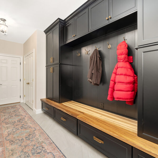 Mudroom with custom cabinetry that opened up the hallway space