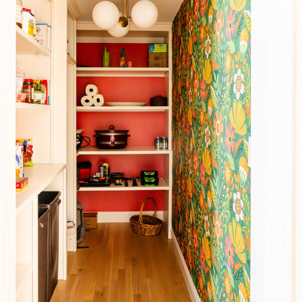 Custom pantry with fun wallpaper to brighten the space in a Marlene & Co renovation