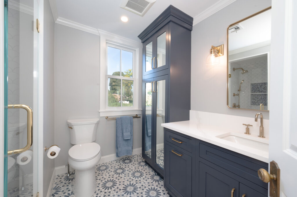 Modern Bath Remodel with Dark Custom Cabinetry by Marlene & Co