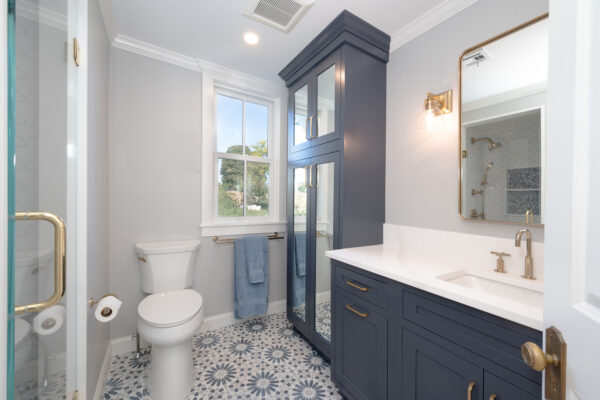 Modern Bath Remodel with Dark Custom Cabinetry by Marlene & Co