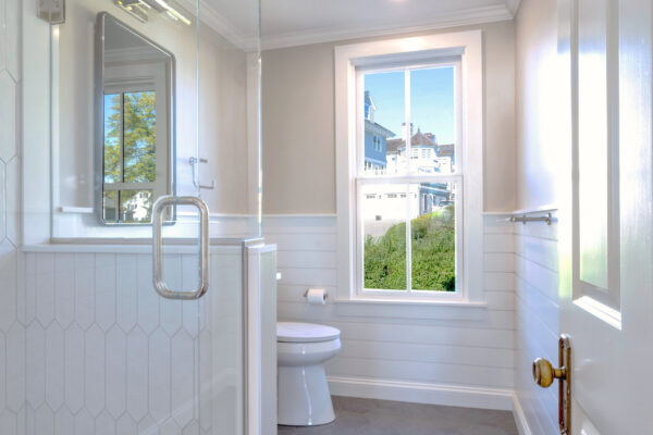 Light and bright bathroom remodel with custom cabinetry by Marlene & Co