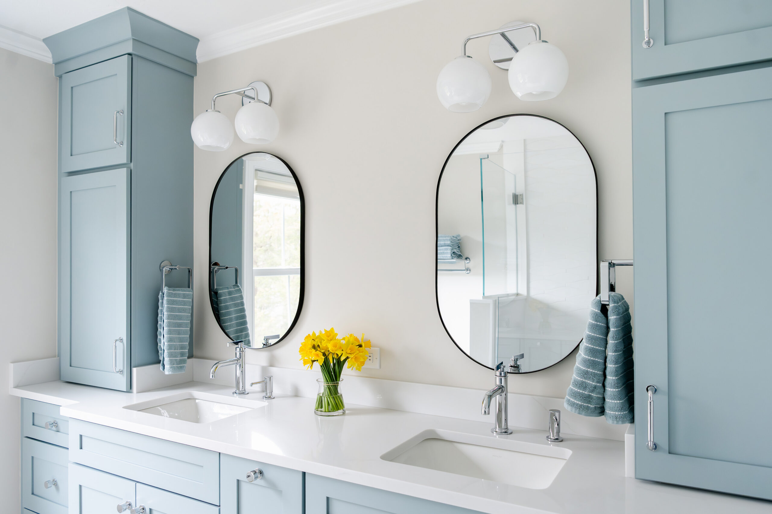 Double Vanity with Blue Custom Cabinetry by Marlene & Co