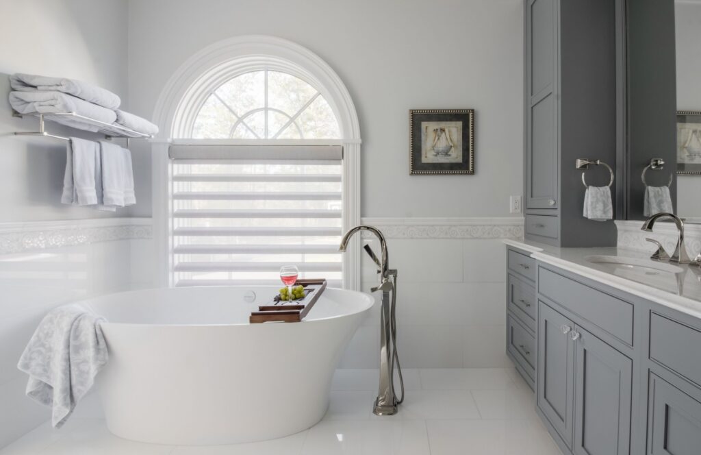 Newly renovated bathroom with a tub design and built by Marlene & Co