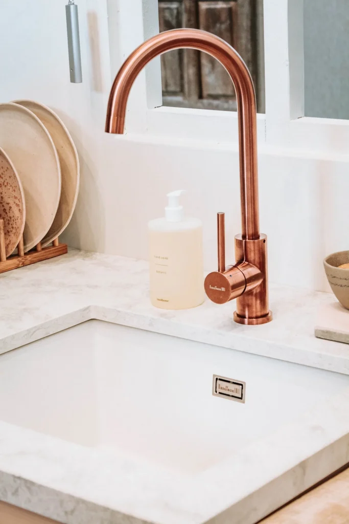 Brass faucet as a design trend for bathroom and kitchen design