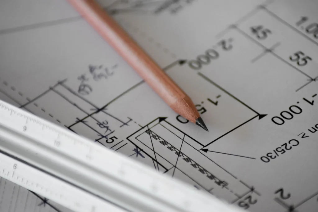 A pencil resting on kitchen remodel plans